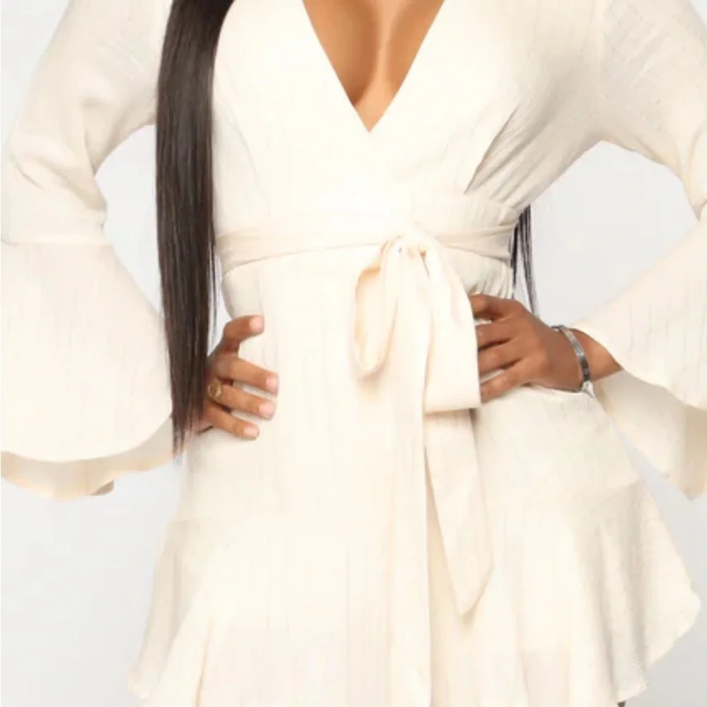Fashion Nova cream with silver stripes short set zip up back. Plunging neckline.
